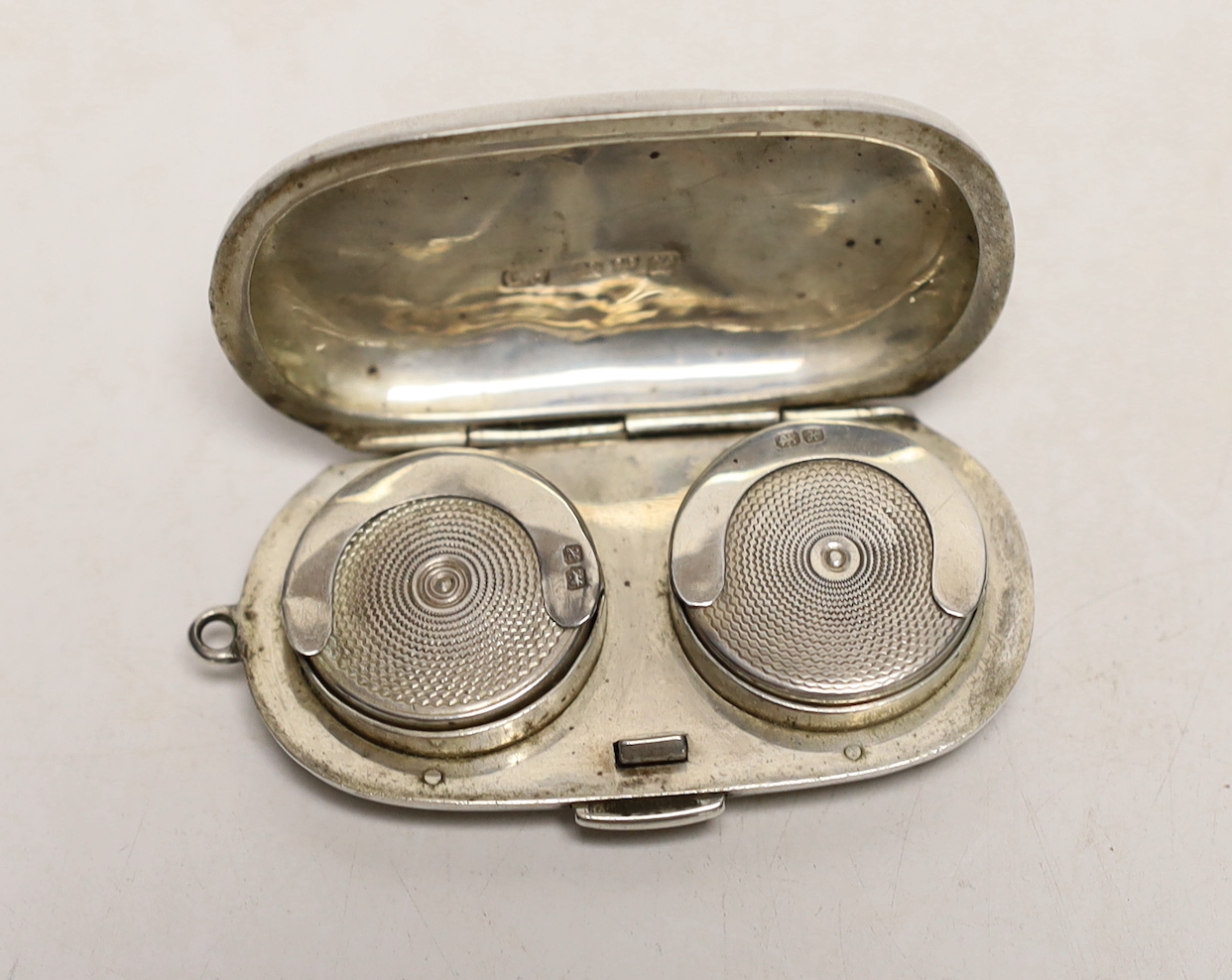 An Edwardian engraved silver oval double sovereign case, by Colen Hewer Cheshire, Chester, 1908, 58mm.